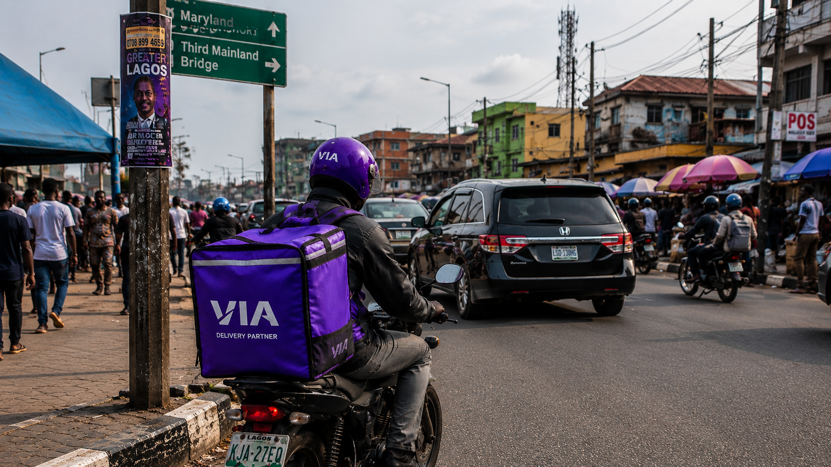 A Via delivery partner riding through Lagos